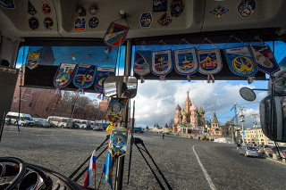 Photo Credit: (NASA/Bill Ingalls) A view of Saint Basil’s Cathedral in Red Square is seen through the front window of the bus carrying Expedition 47 crew members: NASA astronaut Jeff Williams, Russian cosmonauts Alexei Ovchinin, and Oleg Skripochka of Roscosmos, as the crew arrives to lay roses at the site where Russian space icons are interred as part of traditional pre-launch ceremonies Friday, Feb. 26, 2016, Moscow, Russia.